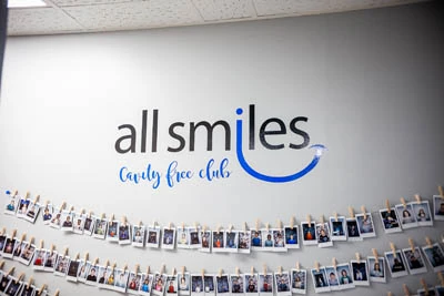 All Smiles Dental cavity free club pictures on their wall